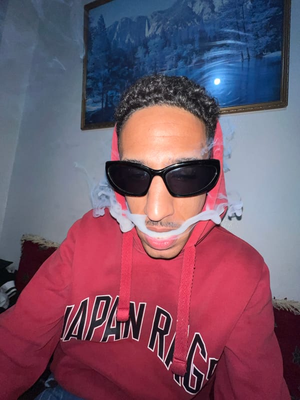 Man smoking indoors in Tangier residence