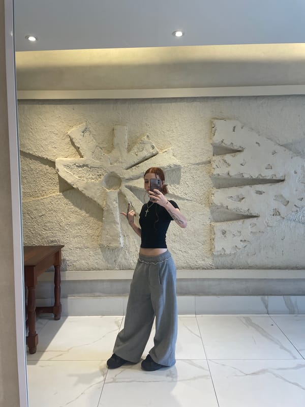 Buenos Aires resident documents elevator selfie, tattoo session