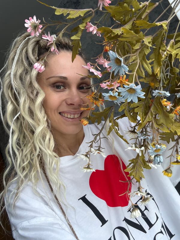 Woman in heart shirt, child playing outdoors observed morning