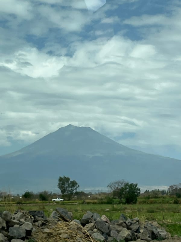 Popocatépetl volcano viewed from Atlixco through cloudy conditions