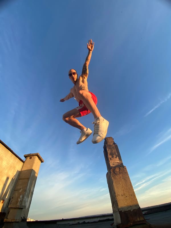 Tattooed man performs acrobatic stunts on Pleven rooftop