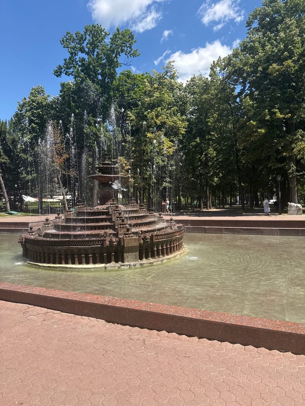 Ornate tiered fountain in a Chișinău park, multiple angles