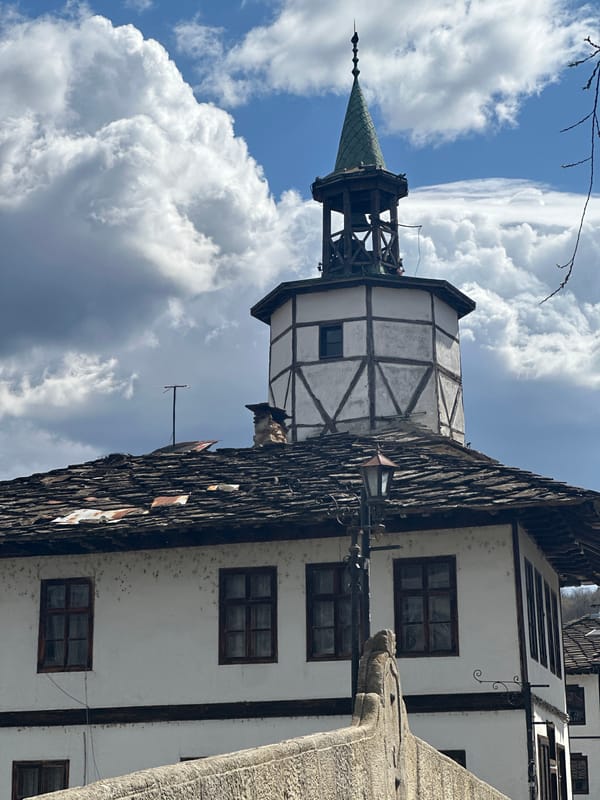 Tourist documents morning walk through historic Tryavna, Bulgaria