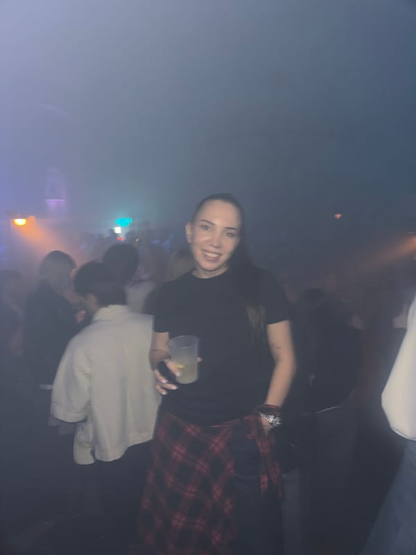 Moscow nightclub, dancing crowd and drinks on the floor