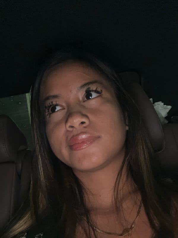 Woman photographed in car passenger seat in South Jakarta