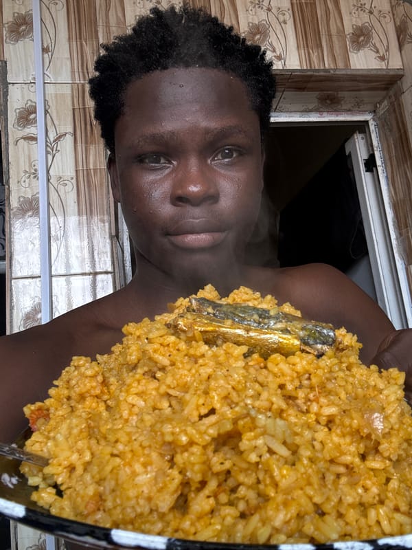 Jollof rice and whole fish served up in Ihiagwa, Nigeria
