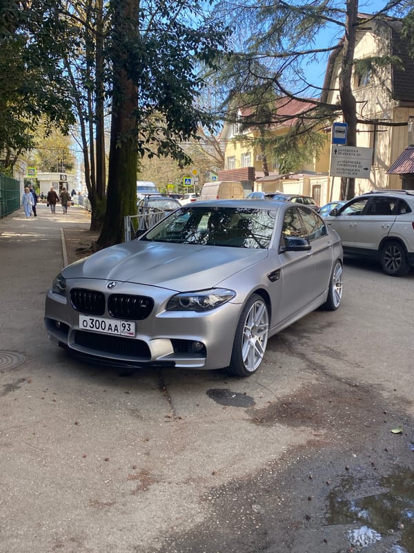 Silver BMW M5 parked on Nevskaya Street in Sochi