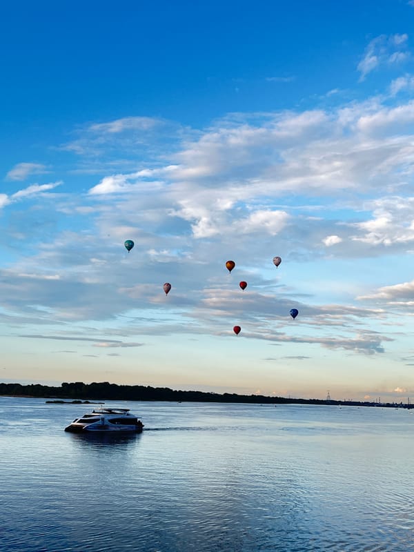 Hot air balloons float above the Volga River in Nizhny Novgorod