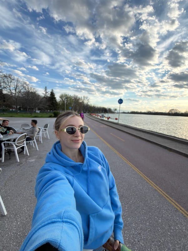 Friends enjoy afternoon drinks at lakeside cafe in Plovdiv