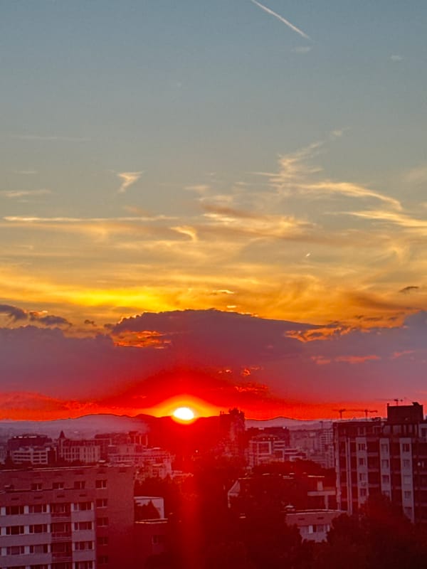 Sofia sunset draws attention from rooftops, windows, and skate parks