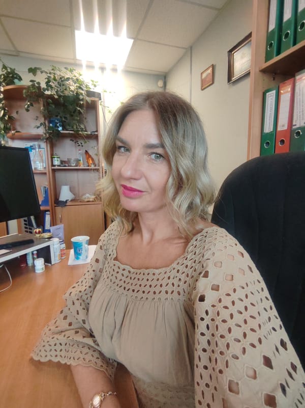 Woman observed at office desk early morning May 14