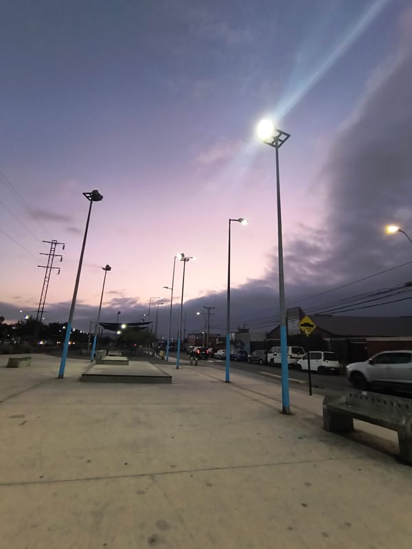 Evening street documentation and car repair in Arica, Chile