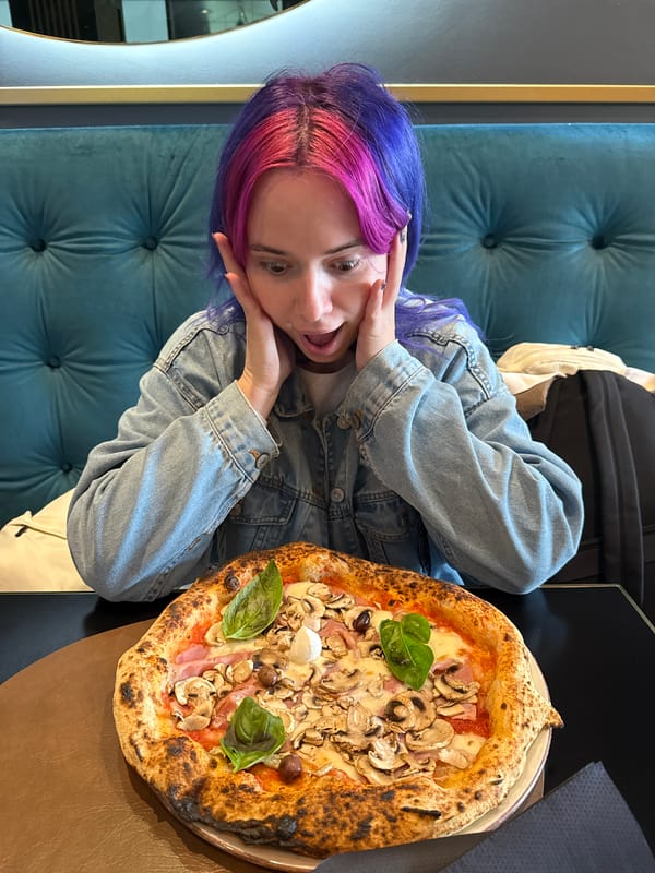 Woman eats pizza with scissors in Zagreb Sunday