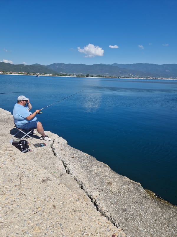 Morning fishing session observed at Greek harbor pier
