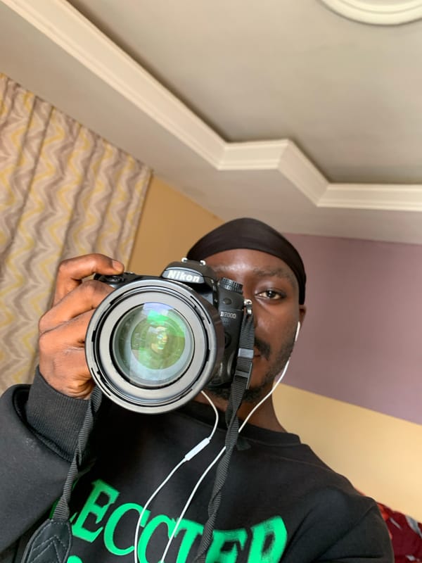Morning in Jos: Nikon in hand, goats and citrus nearby