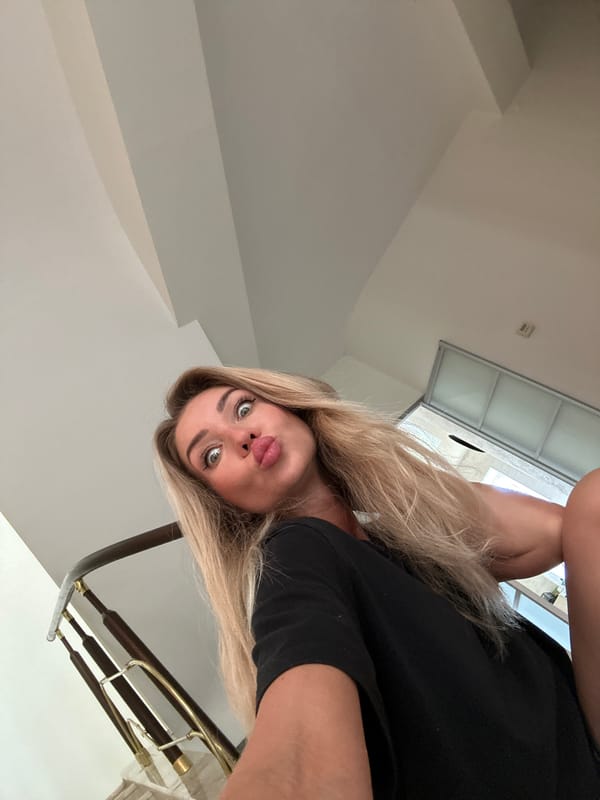Woman conducts selfie photoshoot session with pet poodle in Armavir