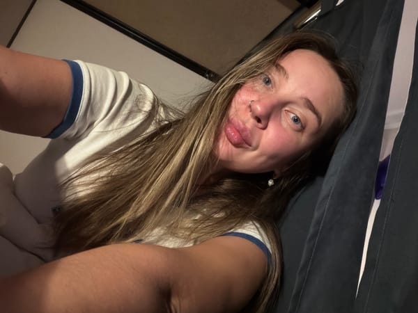 Woman photographed indoors in Moscow evening hours