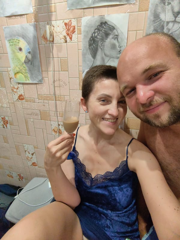 Home gathering in Myadzyel with food, drinks, and pencil art