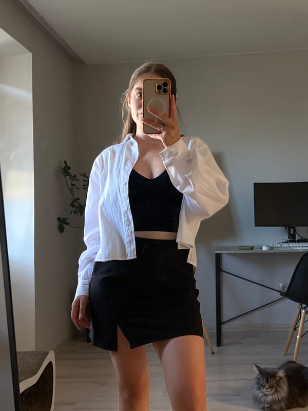 Mirror selfie session in a Ternopil apartment, cat included