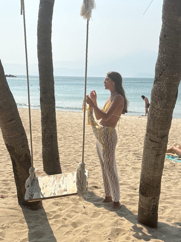 Beachgoers relax with coconut drinks at Đà Nẵng beach