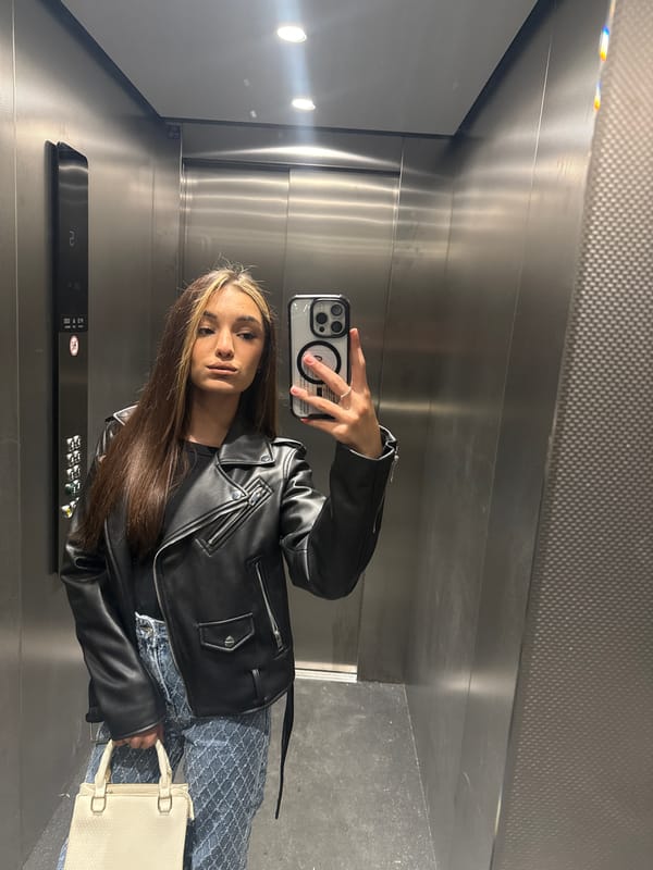 Woman Takes Mirror Selfie in Krefeld Elevator