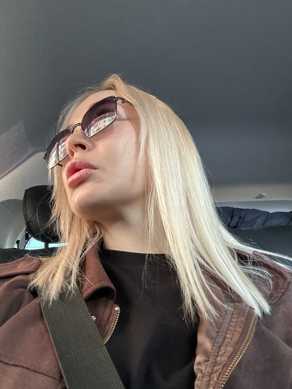 Woman in sunglasses photographed in vehicle, Megion Russia