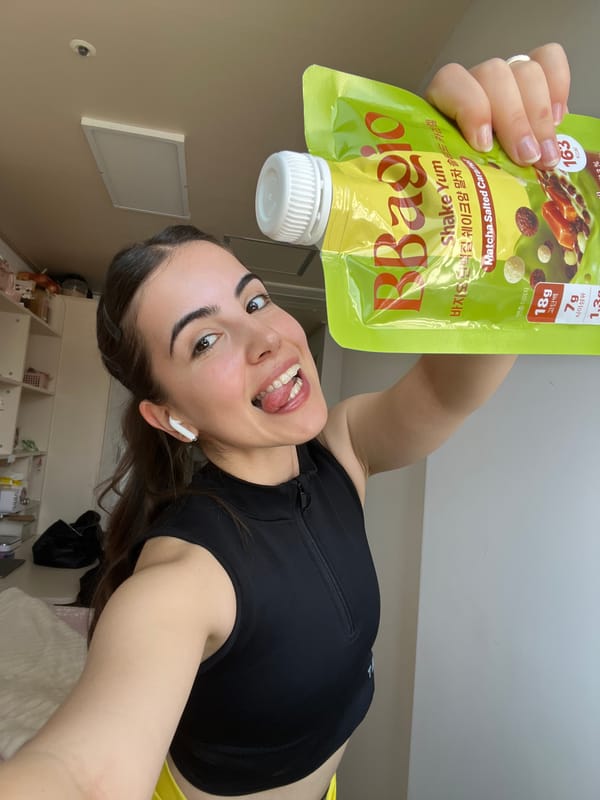 Woman displays protein shake products in Daegu morning photos