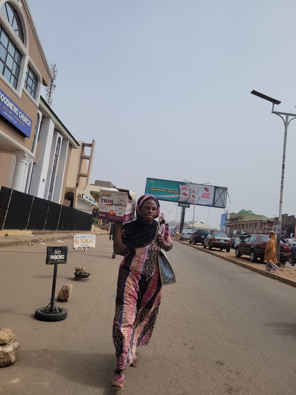 Midday street vendor activity documented in Jos, Nigeria