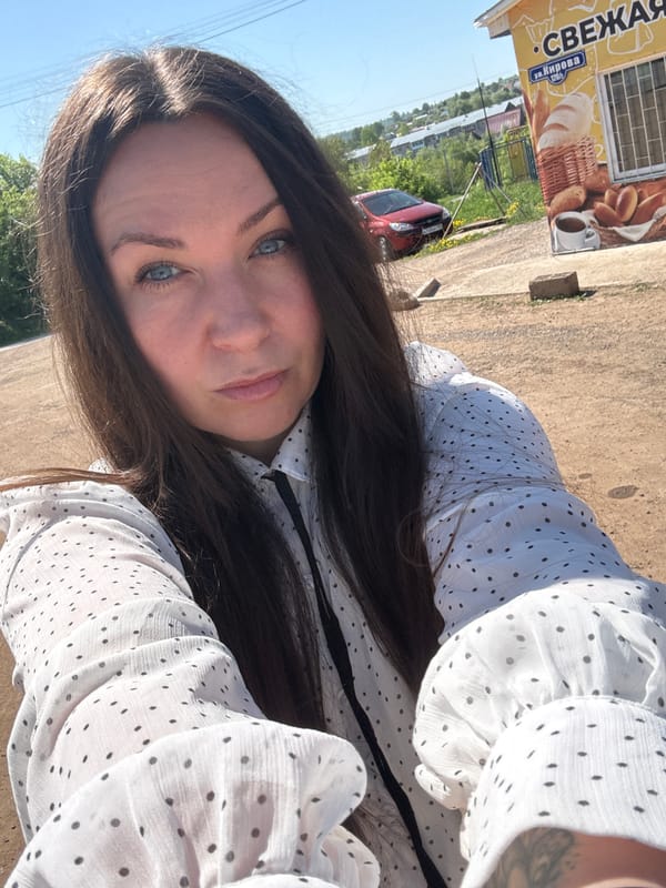 Woman takes outdoor selfies in Фоки, Russia