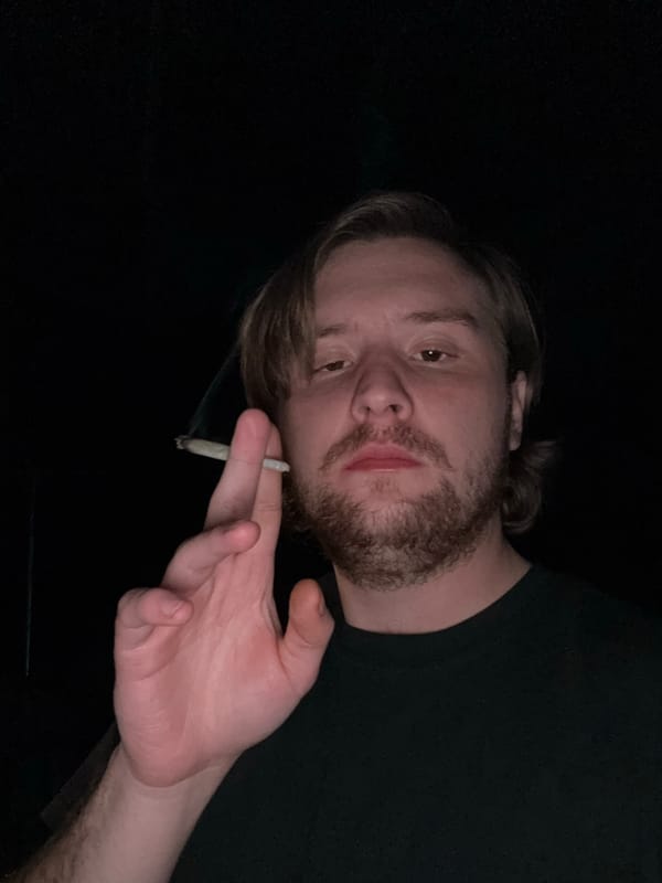 Man smoking cigarette indoors in Mexico early morning
