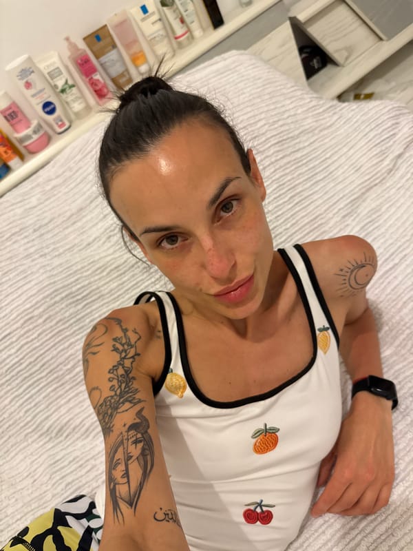 Woman rests on white surface in Chania, Greece