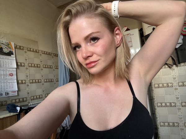 Woman Takes Mirror Selfies in Saint Petersburg Kitchen