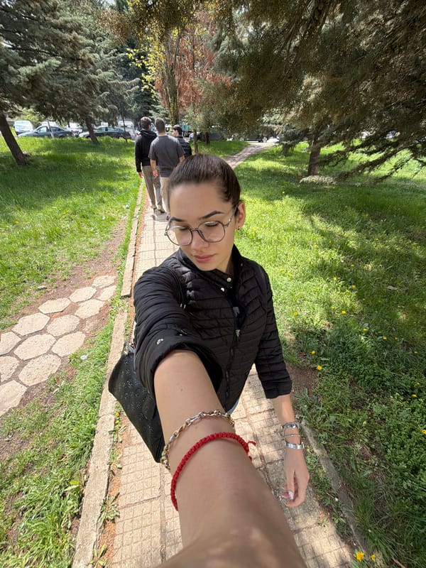 Woman takes selfie in Sofia park on sunny morning