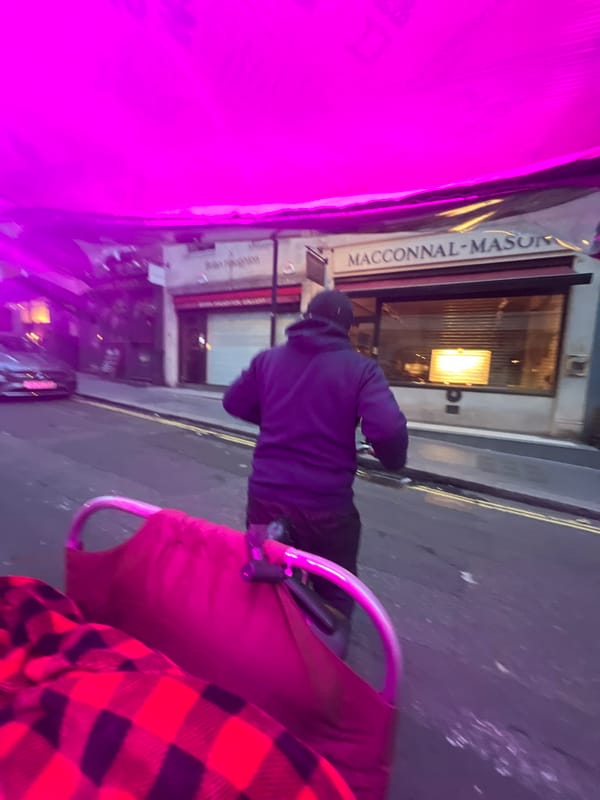 Early morning London scenes: hooded walker, purple-lit selfie