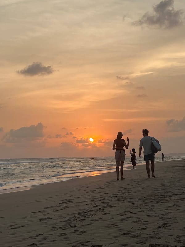 Family enjoys sunset stroll on Kathaluwa beach, Sri Lanka