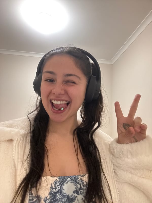 Woman takes playful selfies indoors in Como, Australia