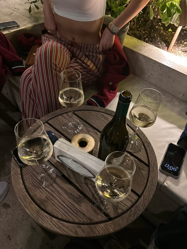 Evening wine service captured at Tbilisi outdoor restaurant
