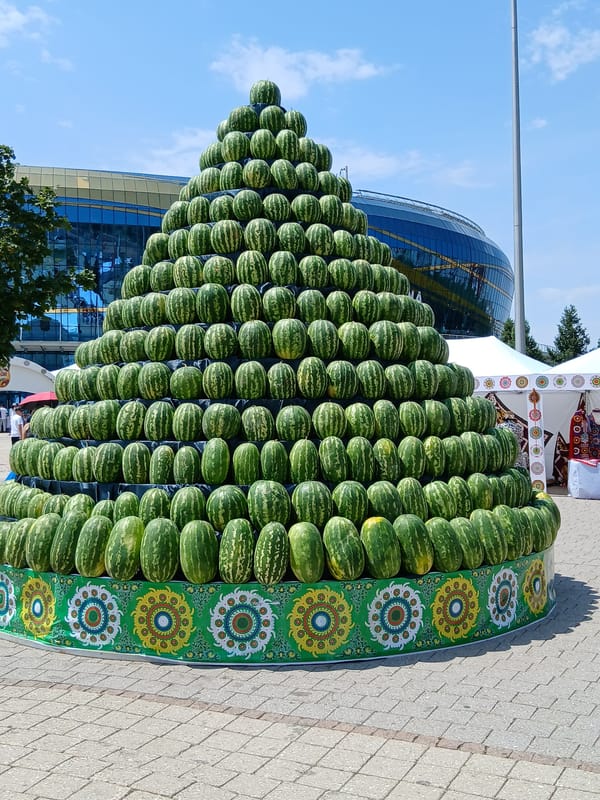 Towering fruit pyramid display outside Almaty Arena