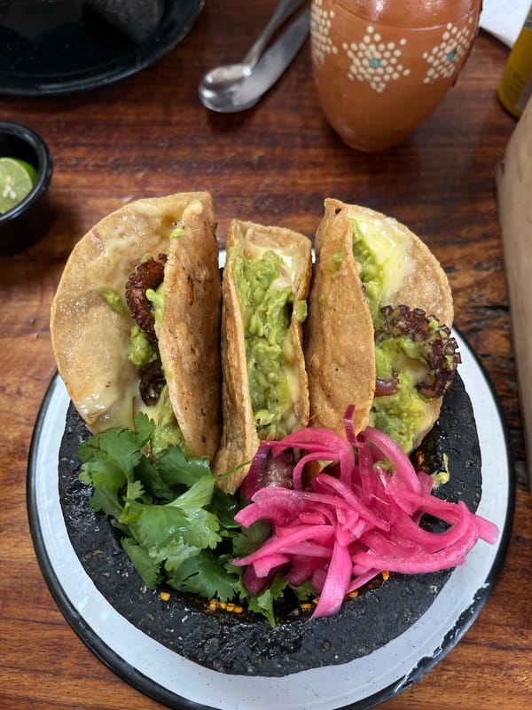 Food gathering documented with tacos, drinks, and celebration