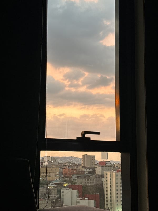 Golden clouds observed through window in Huixquilucan, Mexico