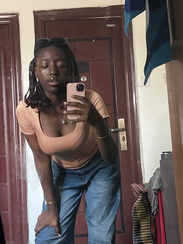 Woman conducts indoor photo session in Abuja, Nigeria