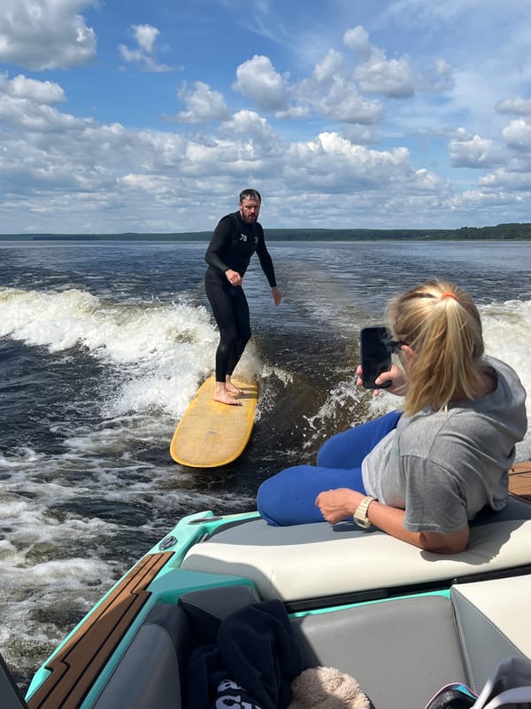 Boating and wakeboarding on a Russian lake in summer