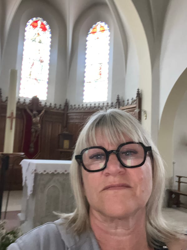 Woman takes selfie inside historic church in Chambœuf
