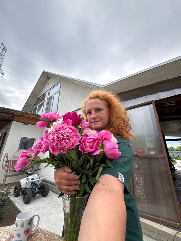 Woman with peonies photographed across Chaikovsky, Russia locations