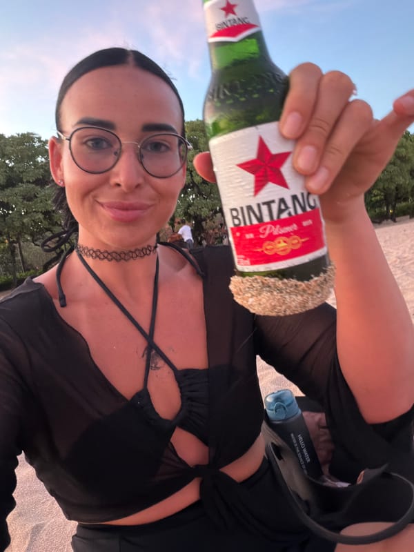Beach picnic with beer and pizza in Bali
