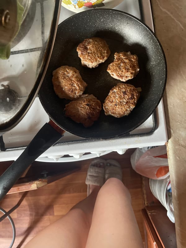 Cutlets frying on a home stove in Shcherbinka