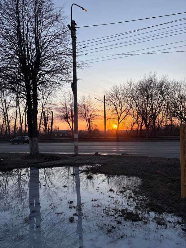 Woman takes sunset selfies on Ulyanovsk street