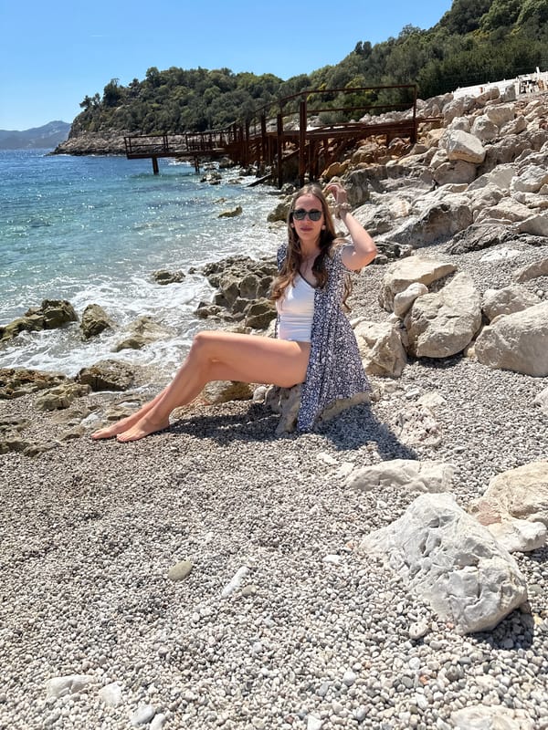 Woman and girl enjoy selfie moment on Turkish pebble beach