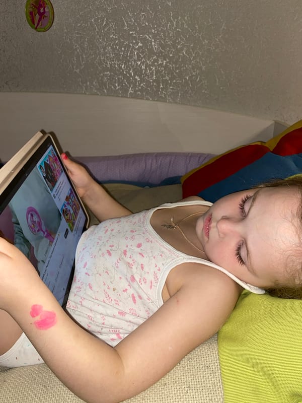 Young girl uses tablet at home in Votkinsk, Russia