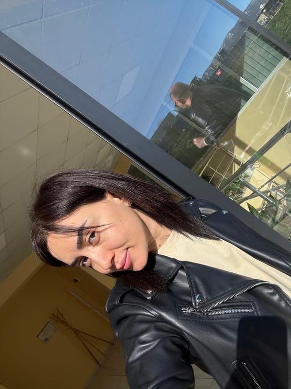 Woman takes morning selfies near Tbilisi construction site